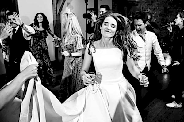 A bride gracefully dancing on the dance floor at a Dodford Manor wedding.