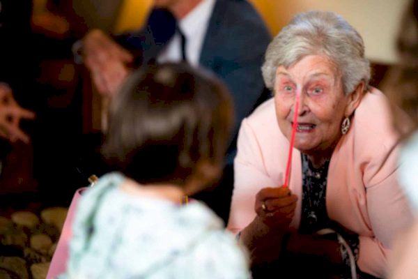 An older woman is talking to a little girl at Dodford Manor.