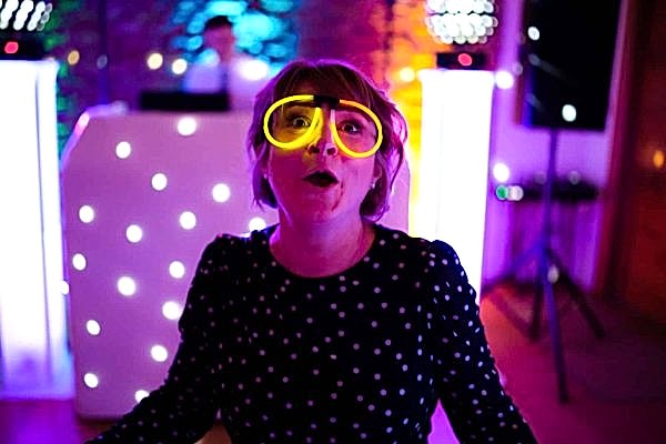 A woman wearing goggles at a Dodford Manor wedding party.